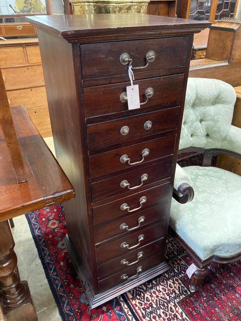 A contemporary hardwood ten drawer narrow chest, width 45cm, depth 45cm, height 125cm